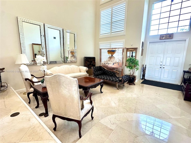 living room with a high ceiling