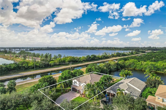 birds eye view of property featuring a water view