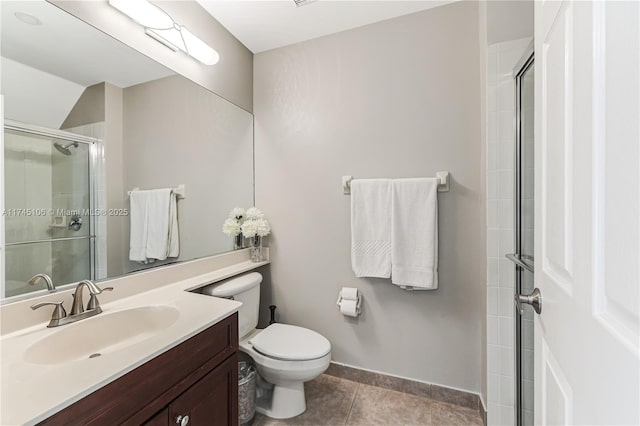 bathroom featuring tile patterned flooring, vanity, toilet, and a shower with shower door