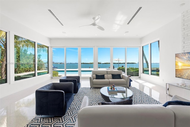 sunroom / solarium with ceiling fan and a wealth of natural light