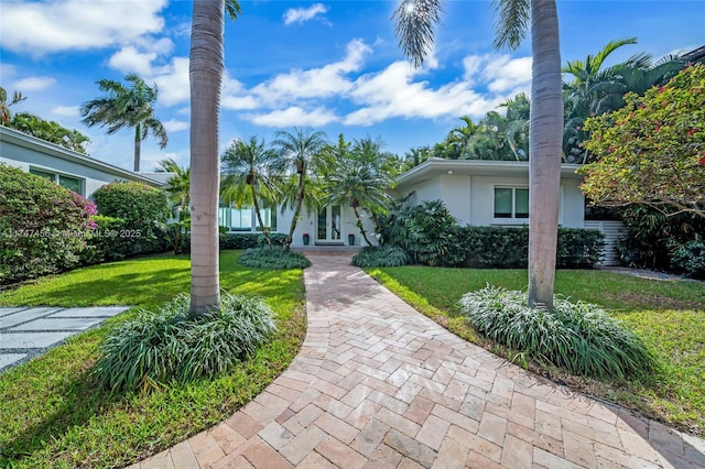7331 Belle Meade Island Dr, Miami, FL 33138 - view of front of house with a front lawn and stucco siding