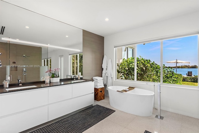7331 Belle Meade Island Dr, Miami, FL 33138 - full bath with double vanity, a shower stall, a freestanding bath, and recessed lighting