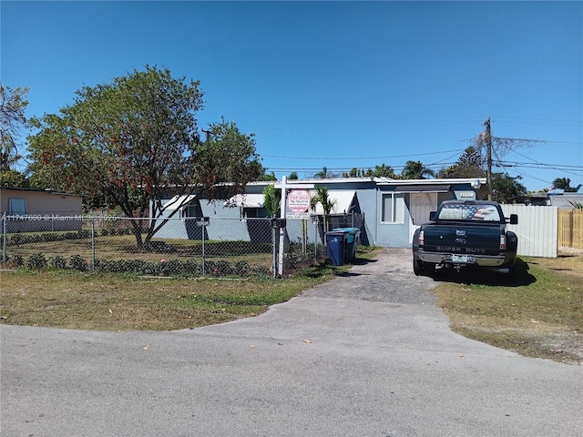 view of front of home featuring fence