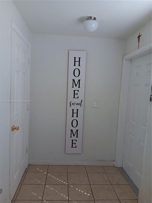 hallway with light tile patterned floors