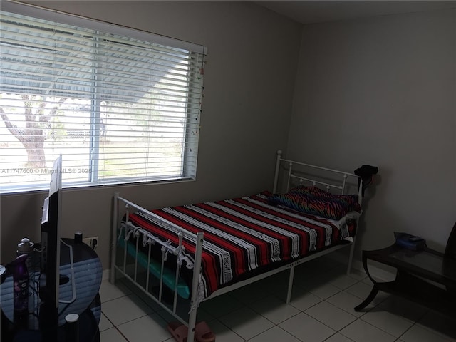 bedroom with light tile patterned floors