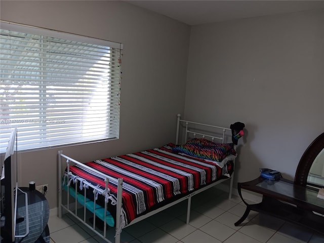 bedroom featuring tile patterned flooring