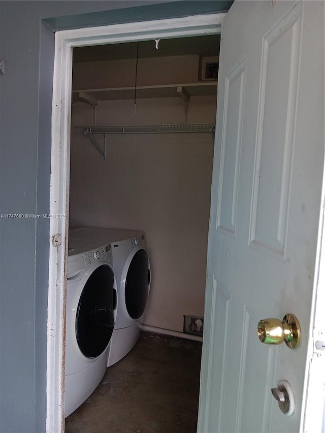 washroom featuring washer and clothes dryer