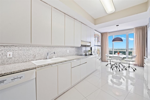 kitchen with white cabinetry, hanging light fixtures, sink, tasteful backsplash, and white dishwasher