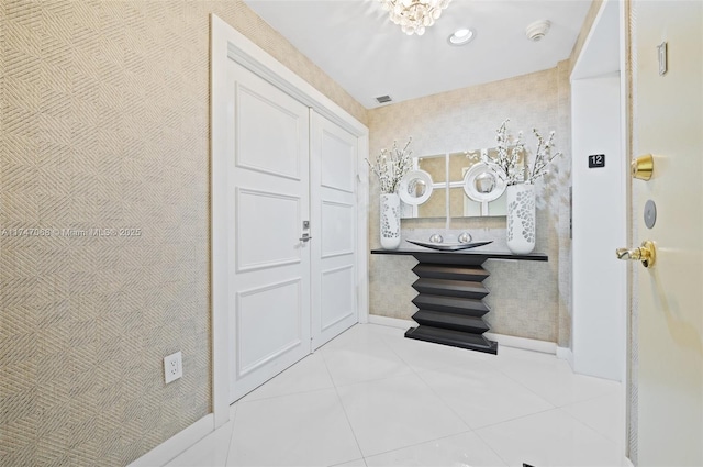 9601 Collins Ave Unit 1208, Bal Harbour, FL 33154 - foyer featuring tile patterned floors, recessed lighting, and a chandelier