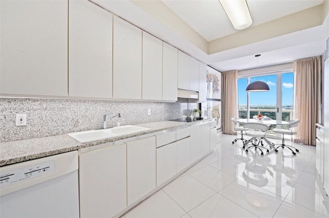 9601 Collins Ave Unit 1208, Bal Harbour, FL 33154 - kitchen featuring dishwasher, white cabinetry, black electric stovetop, tasteful backsplash, and decorative light fixtures