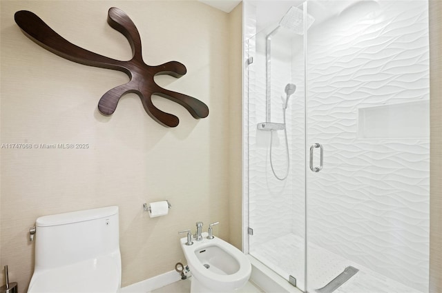 bathroom with a bidet, toilet, and walk in shower