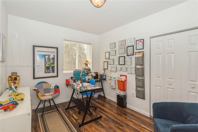 office area featuring dark wood-style flooring and baseboards