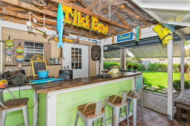 view of patio / terrace with fence and outdoor dry bar