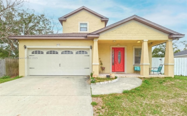 view of front of house featuring a garage and a porch