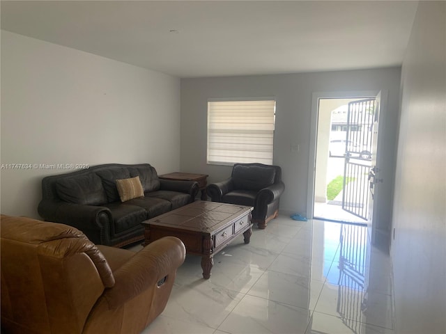 living room featuring marble finish floor