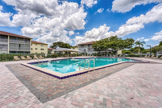 view of swimming pool featuring a patio area