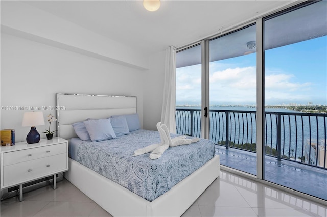 1750 N Bayshore Dr Unit 1602, Miami, FL 33132 - bedroom featuring light tile patterned floors, a water view, access to exterior, and expansive windows