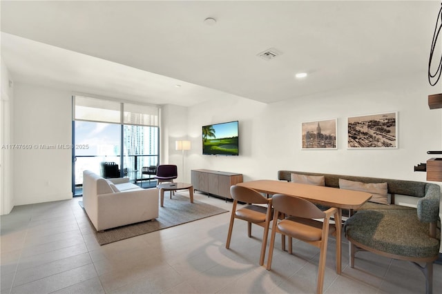 dining area with a wall of windows, recessed lighting, visible vents, and breakfast area