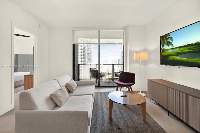 living area featuring floor to ceiling windows