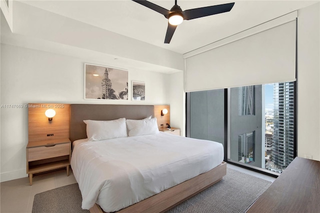 bedroom with access to exterior, baseboards, tile patterned floors, and ceiling fan