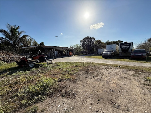 view of yard with a carport