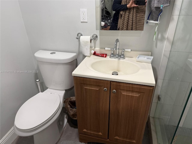 bathroom with toilet and vanity