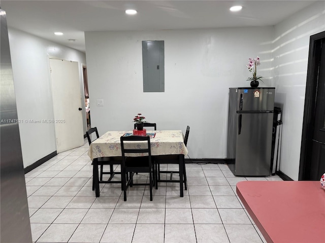 tiled dining room with electric panel