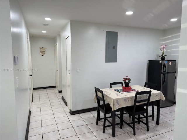 tiled dining space with electric panel