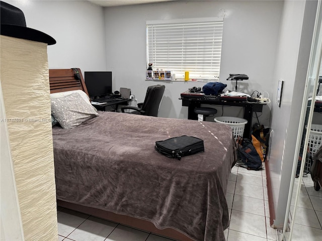 bedroom featuring light tile patterned floors