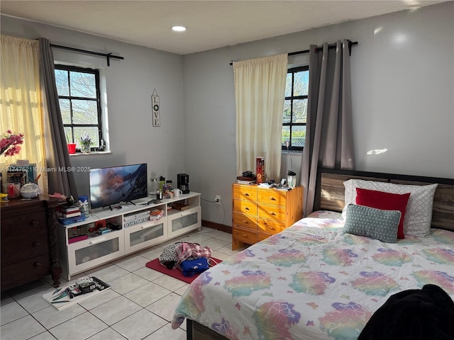 bedroom featuring light tile patterned flooring