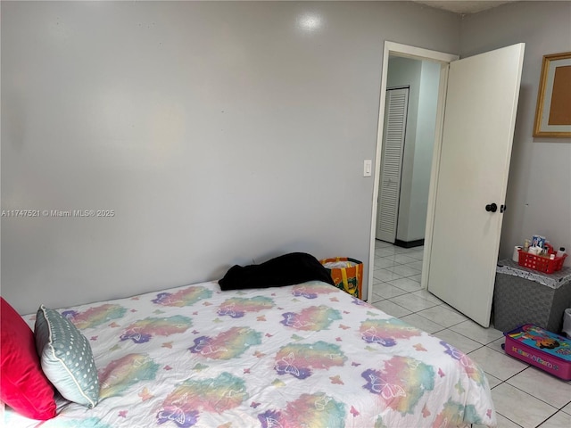 bedroom with light tile patterned floors