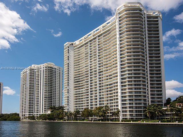 view of property featuring a view of city and a water view