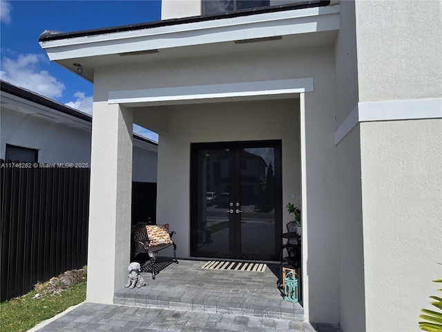 entrance to property featuring french doors