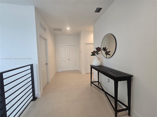 hallway with light tile patterned floors