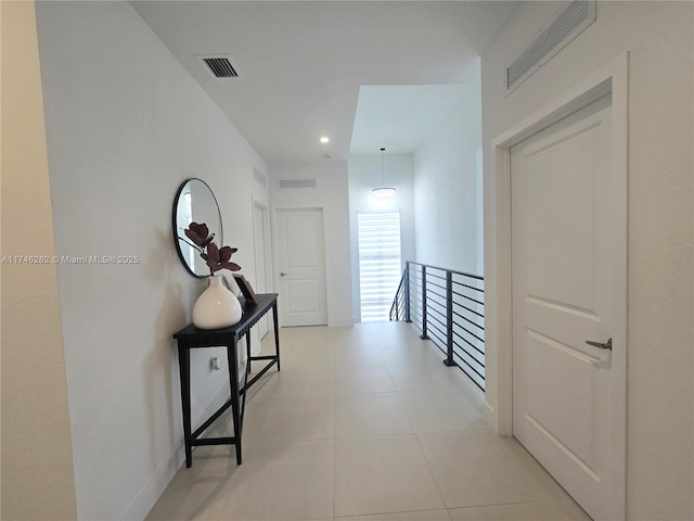 hallway with light tile patterned floors