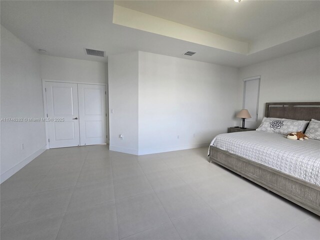bedroom featuring a raised ceiling