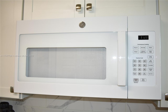 room details featuring white microwave