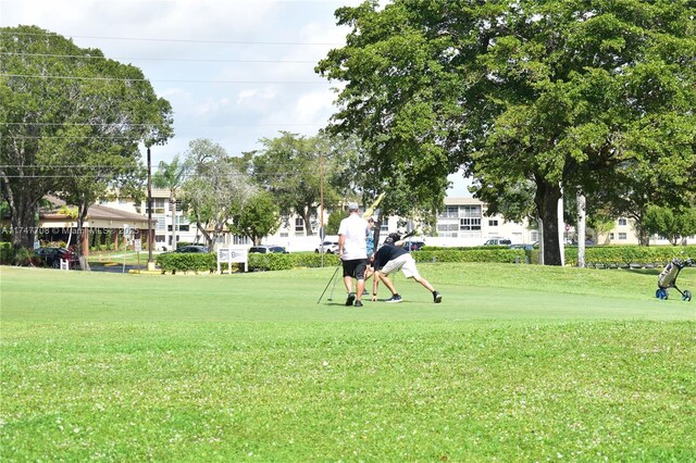 view of property's community with a lawn