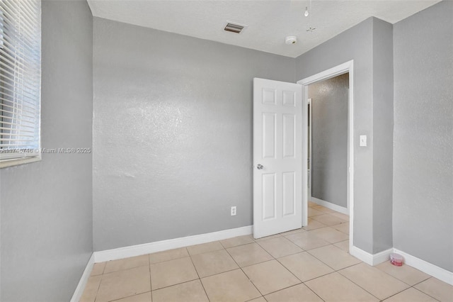 view of tiled spare room