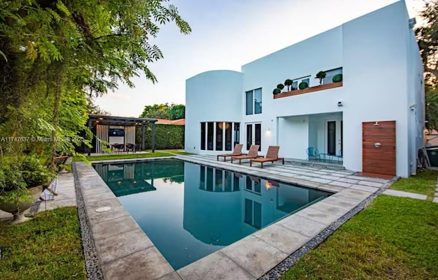 back of property with a patio and a pergola