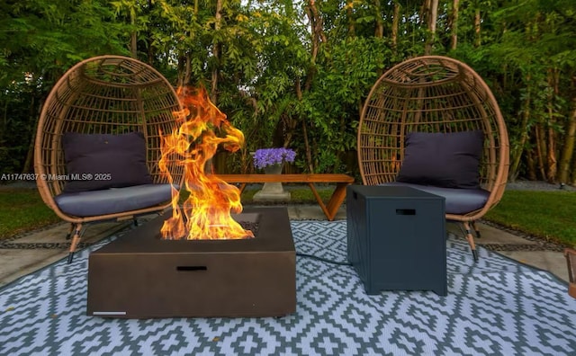 view of patio / terrace with a fire pit