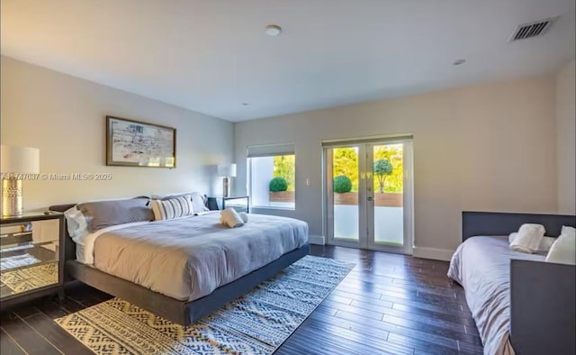 bedroom featuring dark hardwood / wood-style flooring, access to outside, and french doors