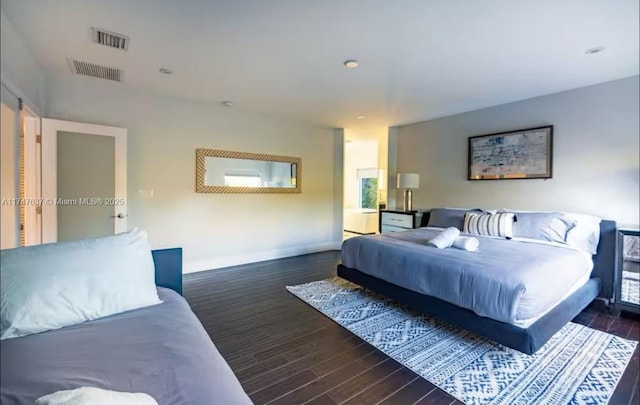 bedroom with dark wood-type flooring