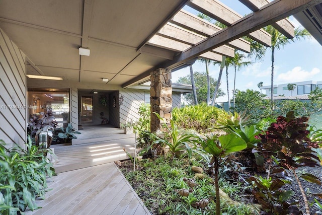 wooden deck featuring a pergola