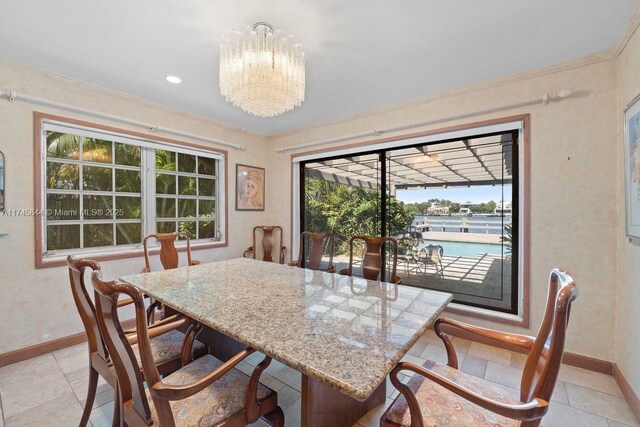 dining room featuring ornamental molding, an inviting chandelier, recessed lighting, and baseboards