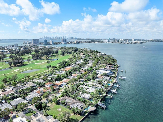 bird's eye view featuring a view of city and a water view