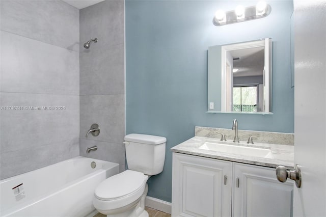 full bathroom featuring vanity, toilet, and tiled shower / bath