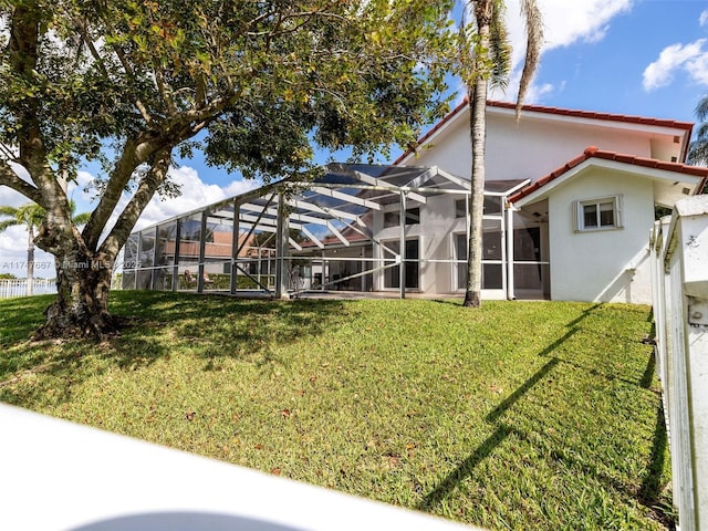 view of yard with glass enclosure