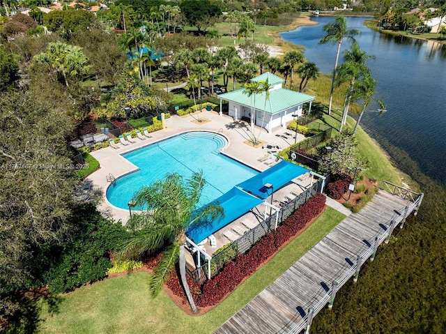 view of swimming pool featuring a water view and a patio area