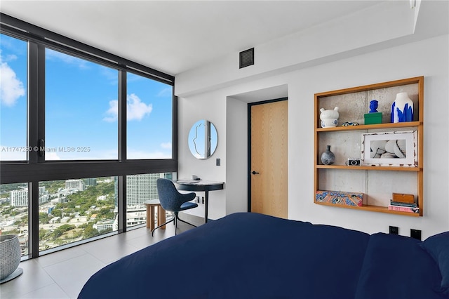 bedroom featuring floor to ceiling windows